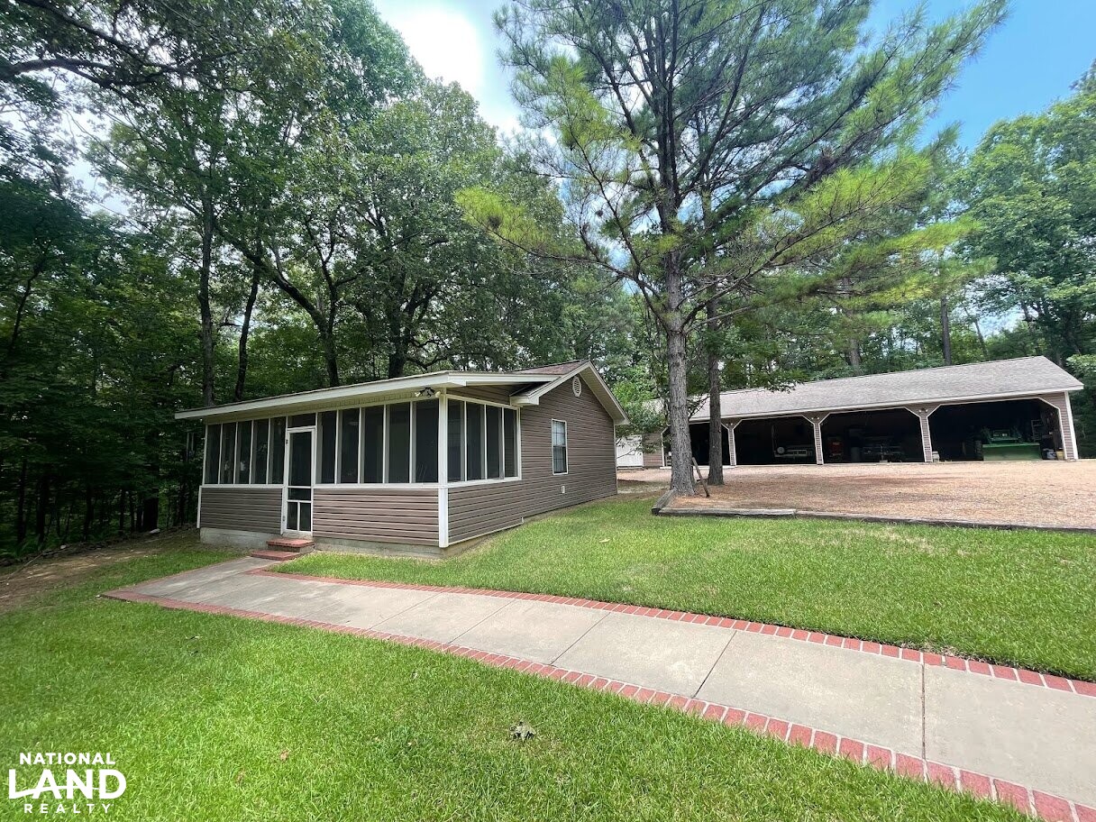 382 Acres of Timber Land with Lodge, Lake, and Bunk House in Grenada