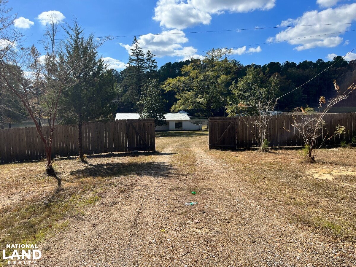 Starter Home/Investment Property With Small Pond Just North of