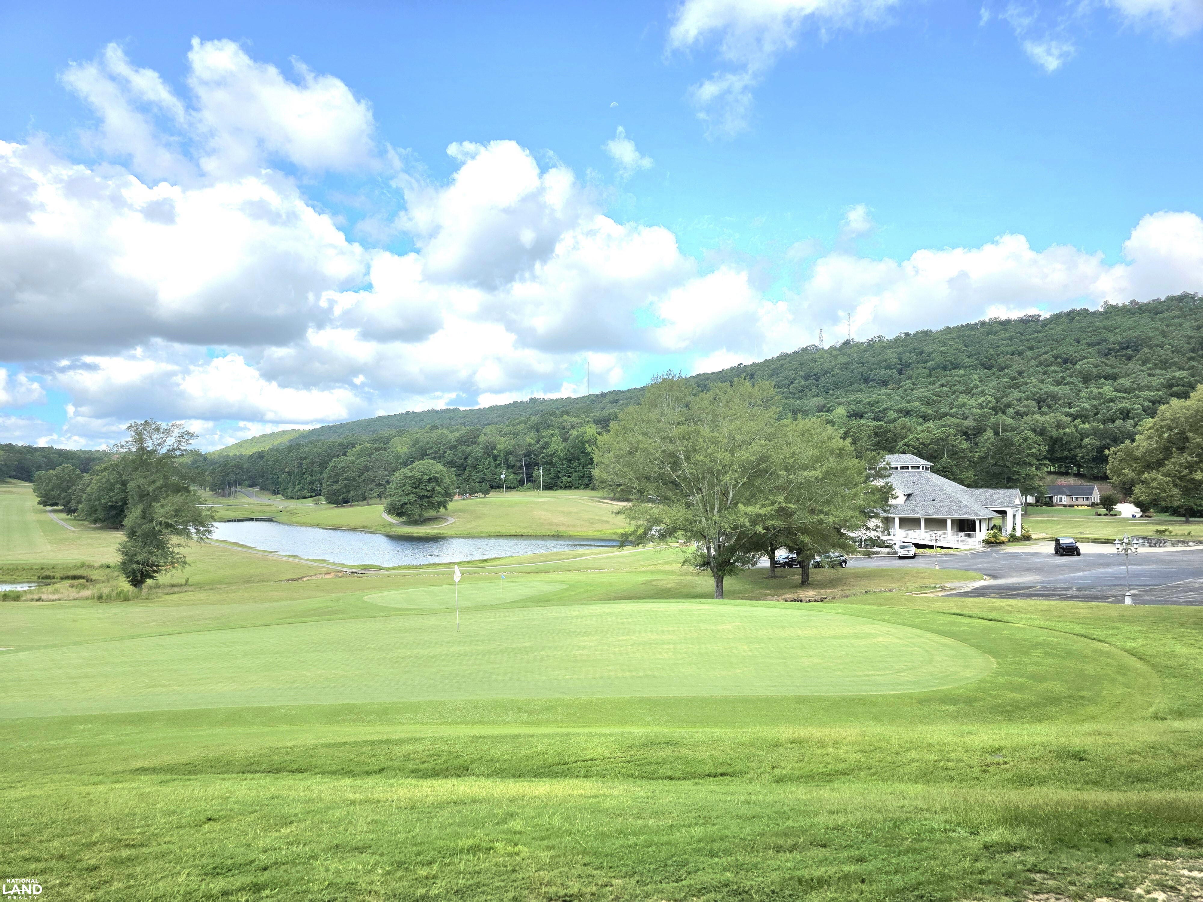 This is a view from the property line the primary homesite is on a ridge overlooking the course and lakes. (7 of 22)