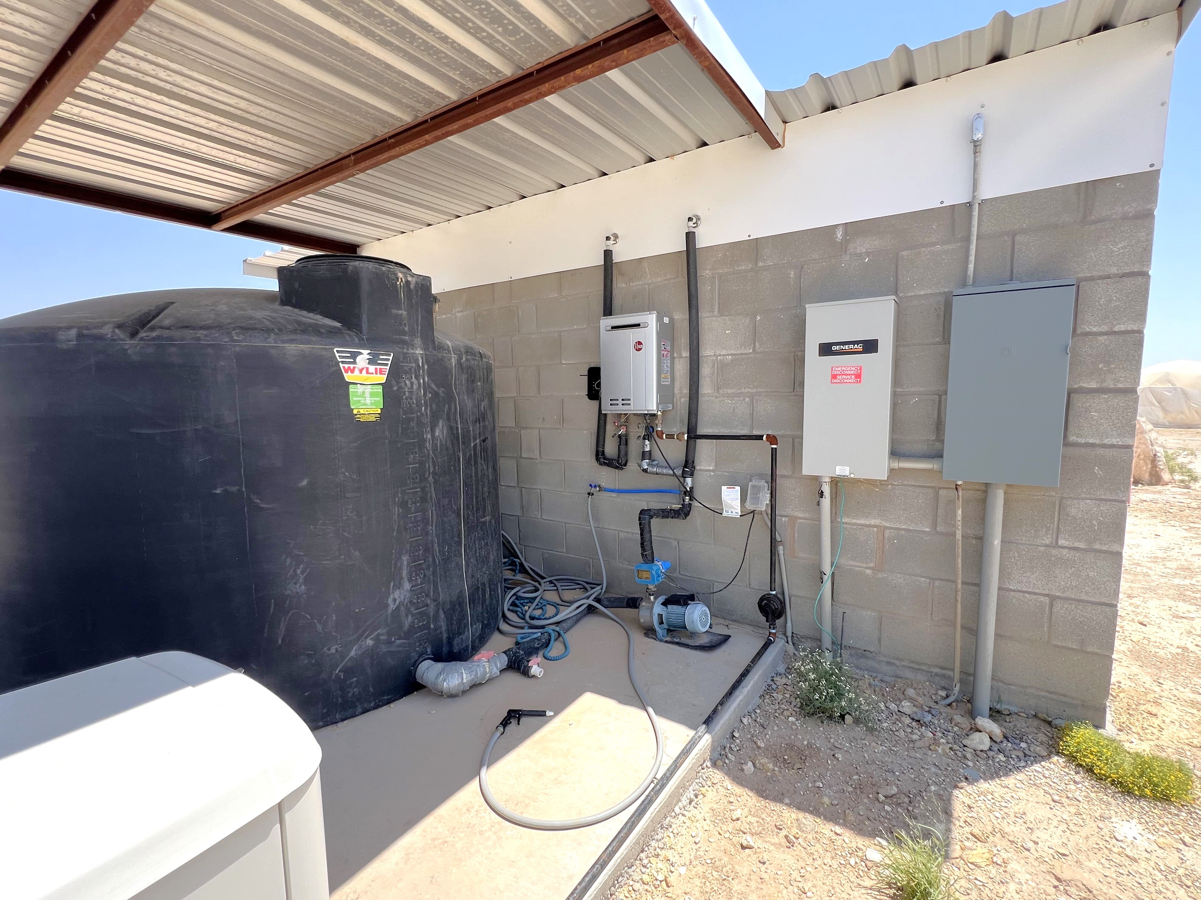 Bath house has 4 private bathrooms with showers. Notice the tankless water heater! (6 of 94)